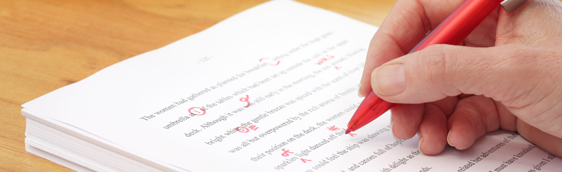Person doing proofreading with red pen